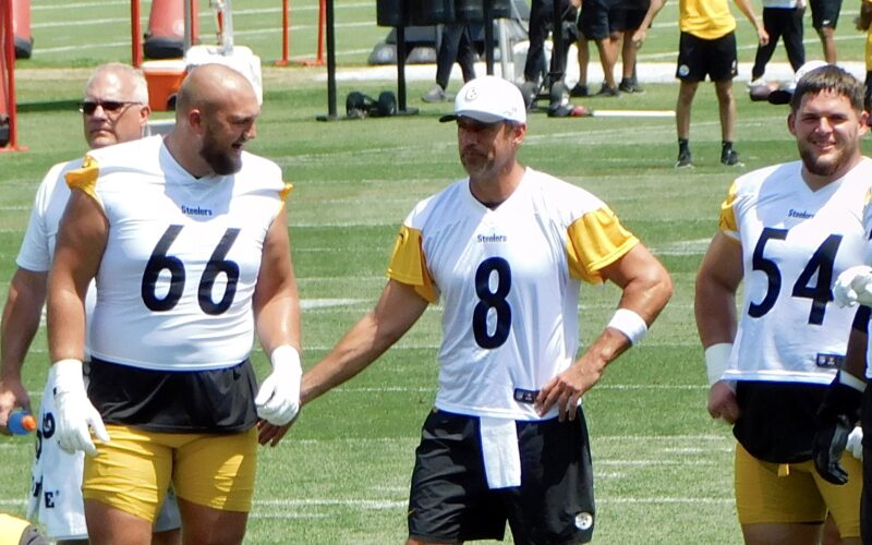 Aaron Rodgers, number 8, with Mason McCormick and Zach Frazier at Pittsburgh Steelers practice in July 2025
