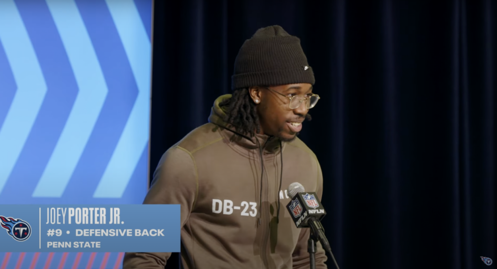 Joey Porter Jr. speaking at a microphone during the 2023 NFL Scouting Combine