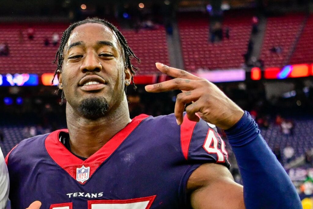 Ogbo Okoronkwo in a Houston Texans uniform after a 2022 game at NRG Stadium