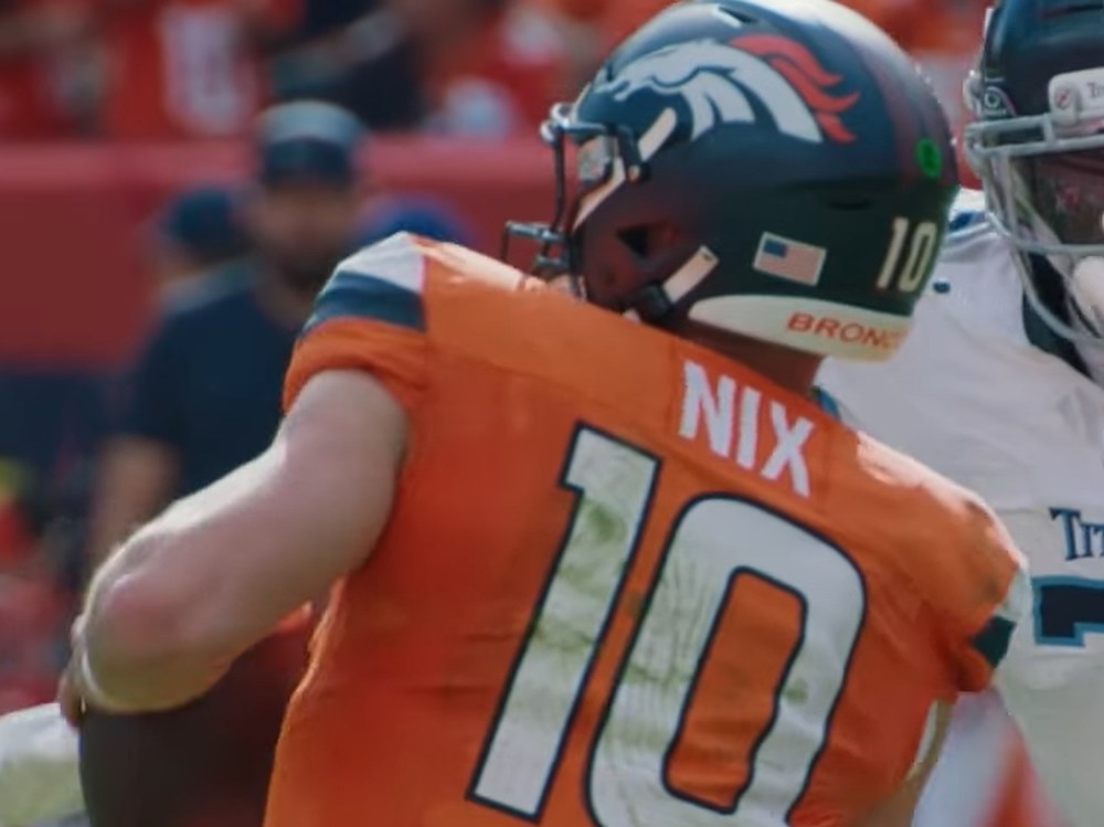 Bo Nix in an orange Broncos No. 10 jersey dropping back to pass