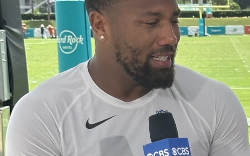 Bradley Chubb speaking into a microphone during a training camp interview