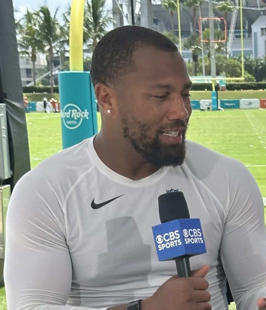 Bradley Chubb speaking into a microphone during a training camp interview