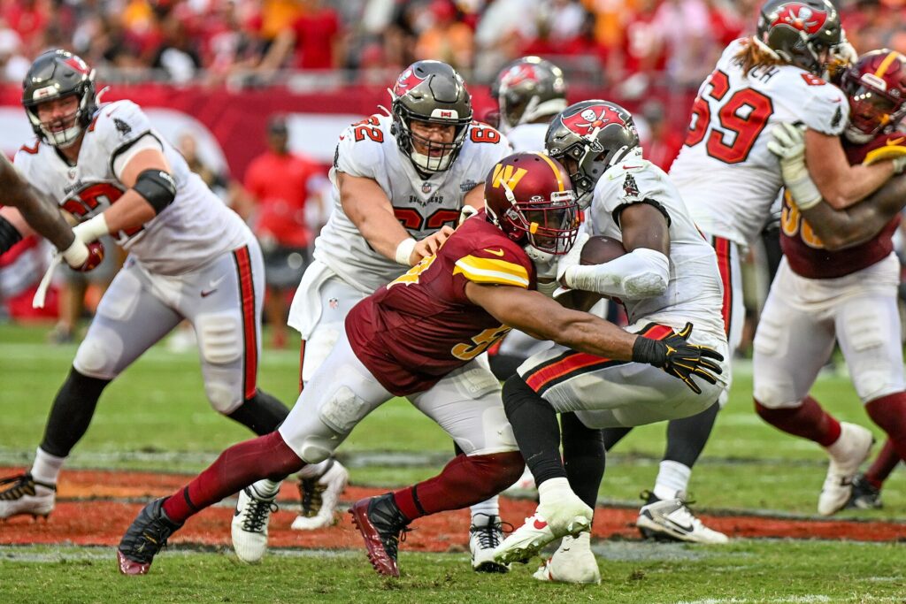 A Buccaneers running back carries the ball against Washington at Raymond James Stadium