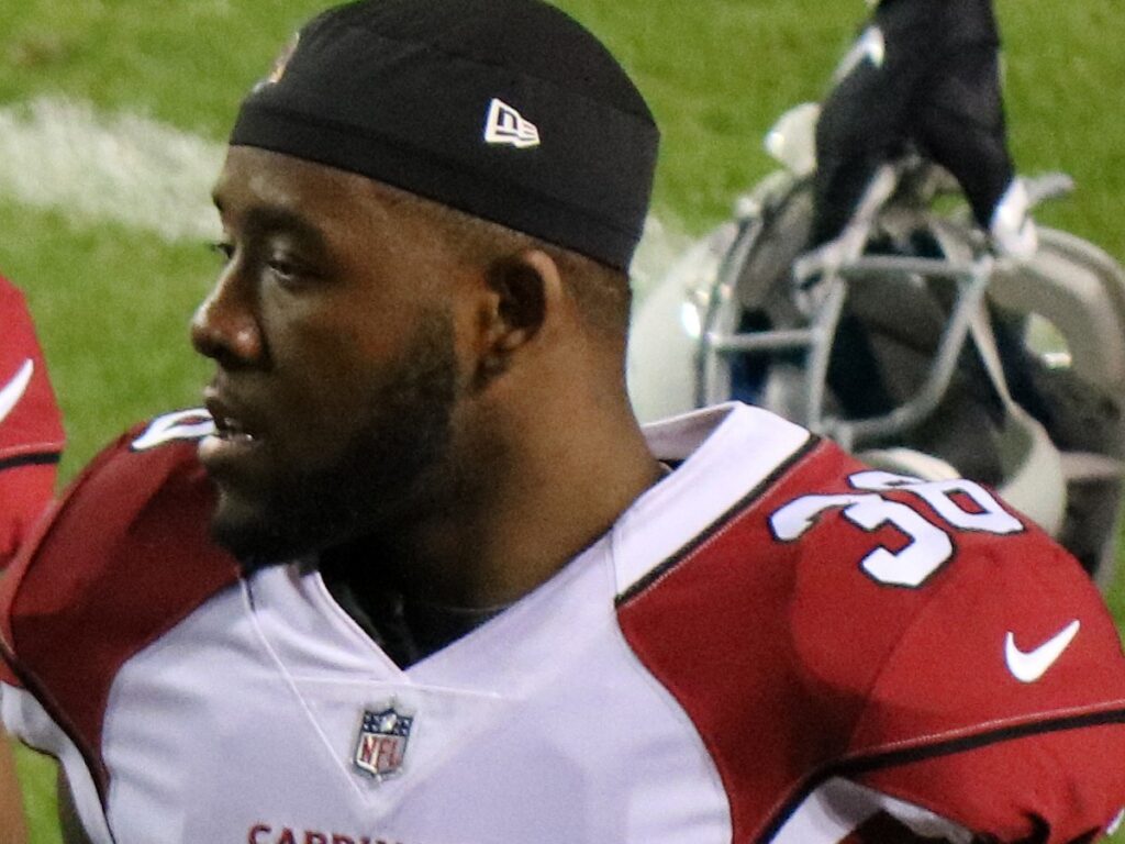 Budda Baker in a white Cardinals No. 36 jersey on the field