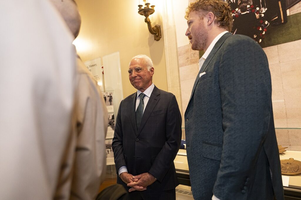 Cam Jurgens at right and Jeffrey Lurie at center during the Eagles’ April 2025 visit to Arlington National Cemetery.