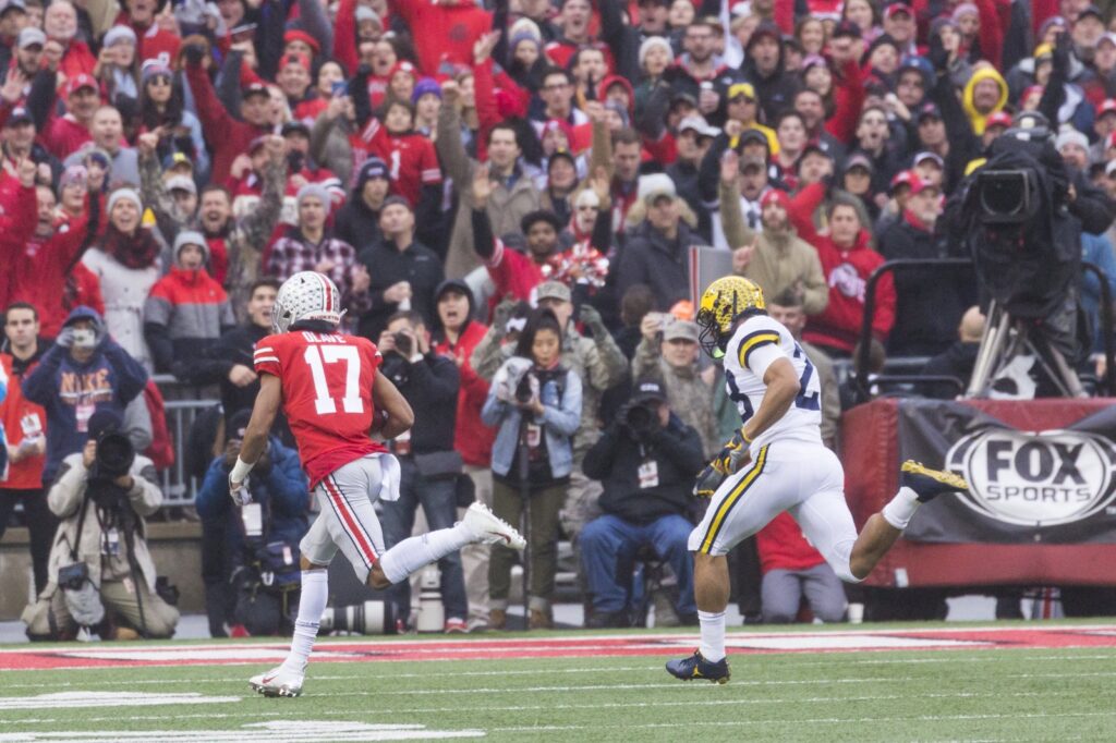 Chris Olave running with the ball for Ohio State against Michigan in 2018