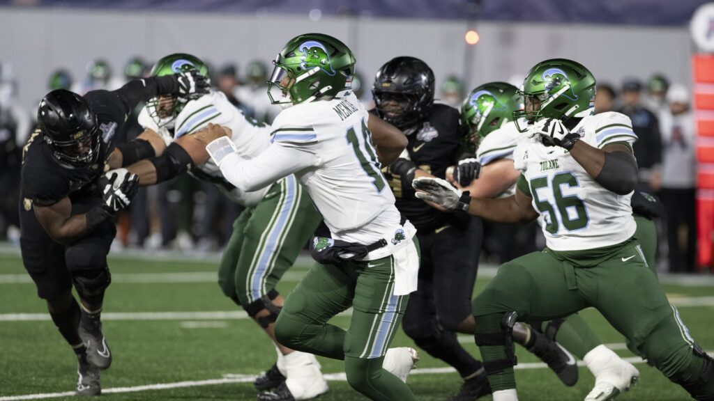 Darian Mensah, then Tulane's quarterback, drops back against Army in December 2024.