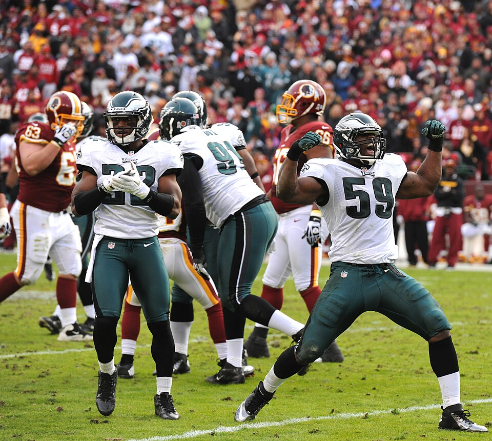 DeMeco Ryans, number 59 at right, celebrates as a Philadelphia Eagles linebacker in a 2012 game against Washington.