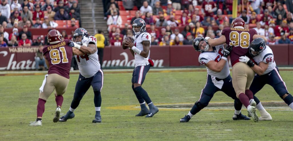 Deshaun Watson of the Houston Texans drops back to pass behind his offensive line