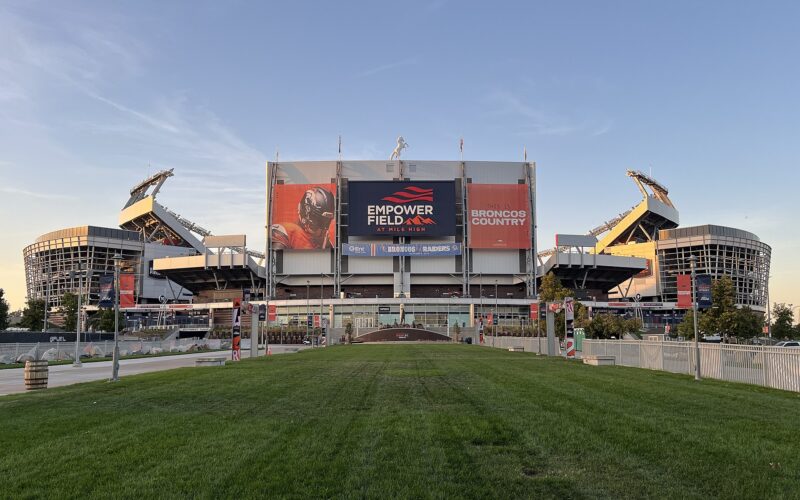 Empower Field at Mile High, home of the Denver Broncos, at sunset.