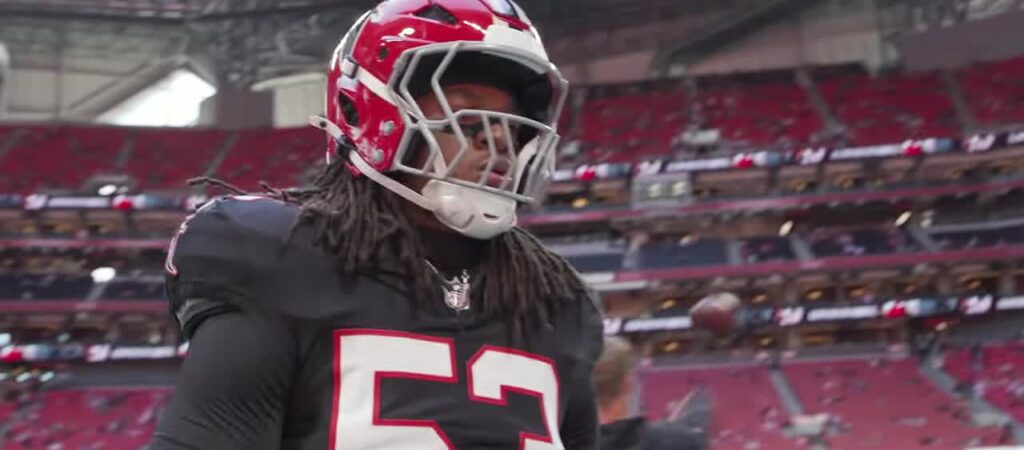 Falcons linebacker Kendal Daniels in his red throwback helmet on the field before the game against the 49ers