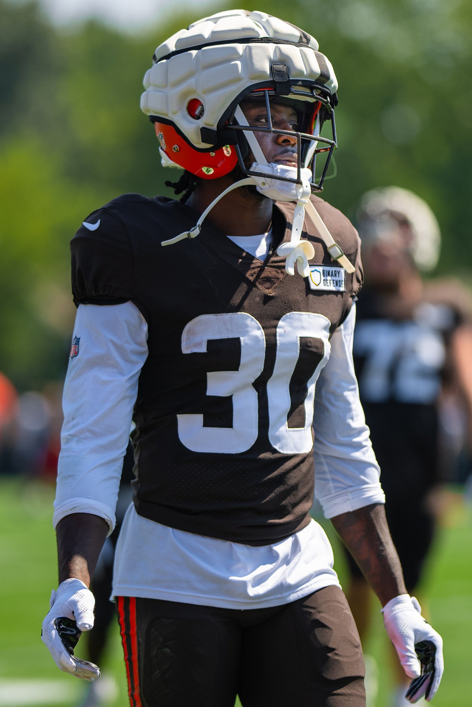 Hassan Hall wearing a padded practice cap