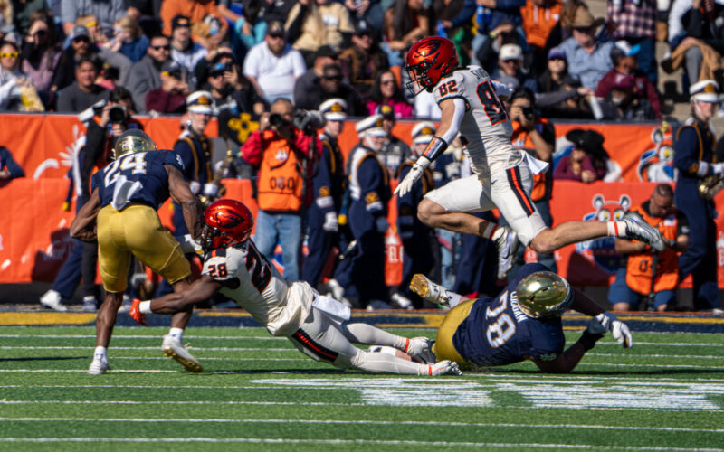 Notre Dame running back Jadarian Price, number 24, is approached by Oregon State defenders during the 2023 Sun Bowl.