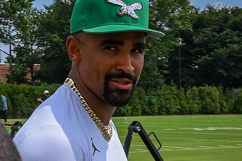 Jalen Hurts in a green Eagles cap at Philadelphia Eagles training camp in July 2025
