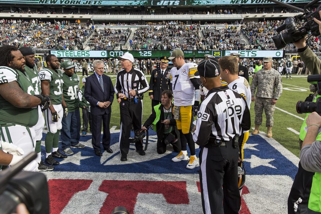 Jets and Steelers players at the coin toss at MetLife Stadium in 2014