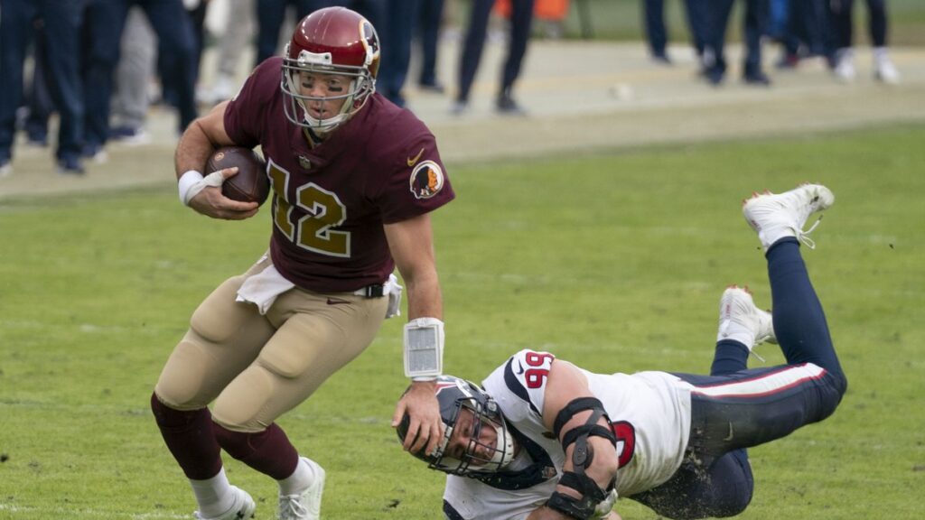 JJ Watt dives at Colt McCoy during a Texans game in November 2018