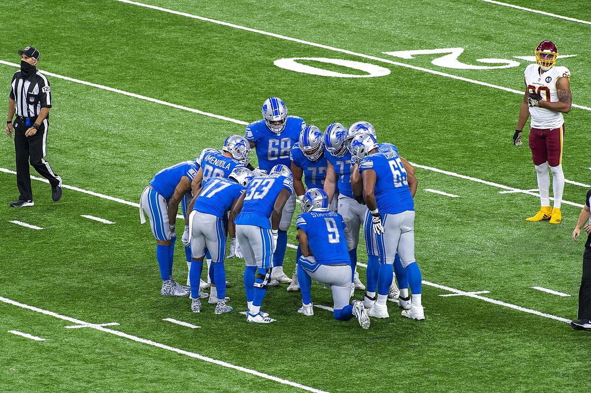 Detroit Lions offense in the huddle at Ford Field