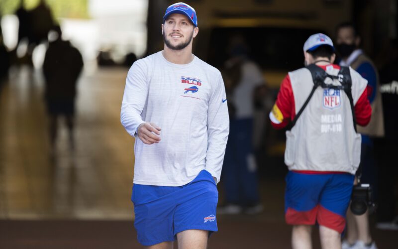 Josh Allen wearing Buffalo Bills training clothes and a cap before a September 2021 game.