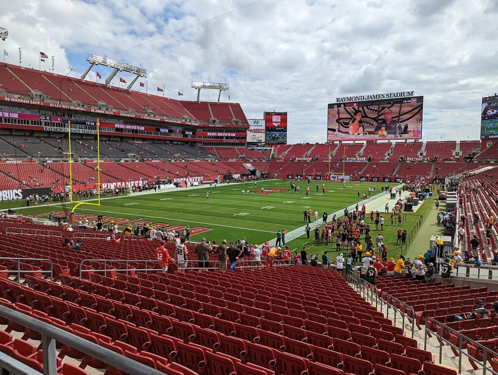 An archival wide view of the football field and red seating at Raymond James Stadium in Tampa.