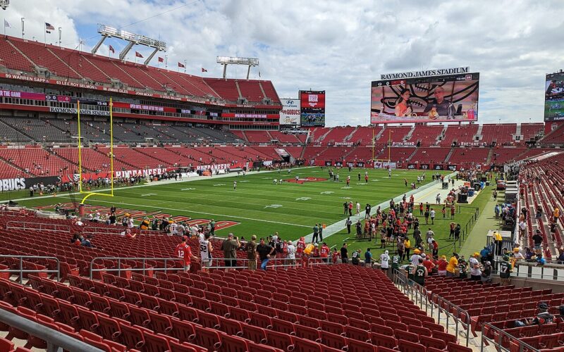 An archival wide view of the football field and red seating at Raymond James Stadium in Tampa.