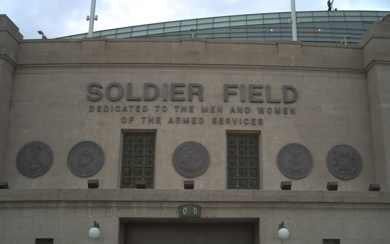 The Soldier Field name and military dedication on the stadium’s stone exterior in an archival photograph.