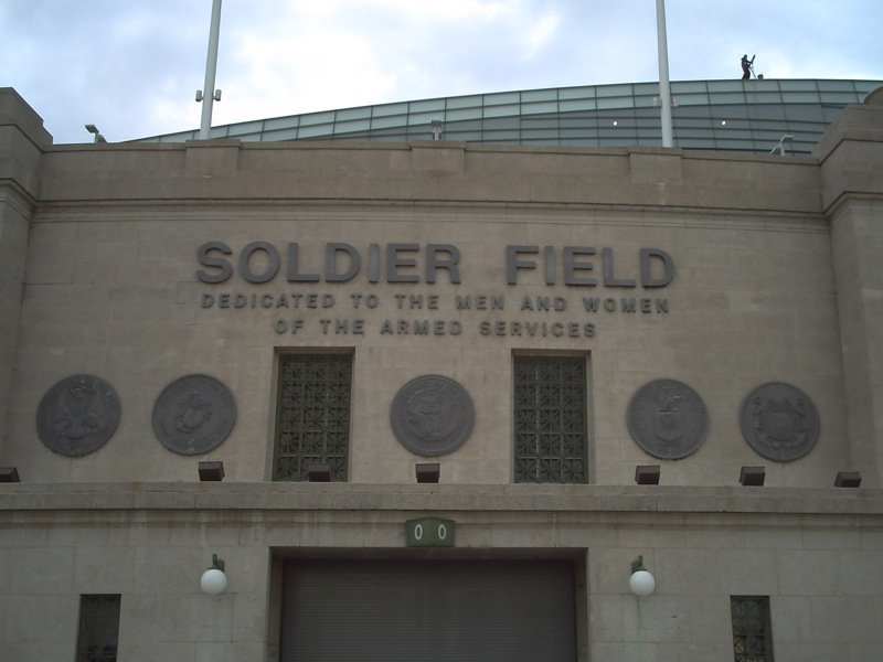 The Soldier Field name and military dedication on the stadium’s stone exterior in an archival photograph.