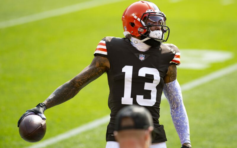 Odell Beckham Jr. wearing Cleveland’s No. 13 uniform and holding a football during a September 2020 game against Washington.