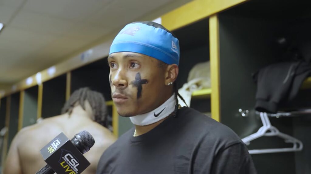 Panthers cornerback Marco Wilson speaks to reporters in the locker room after the game at Green Bay