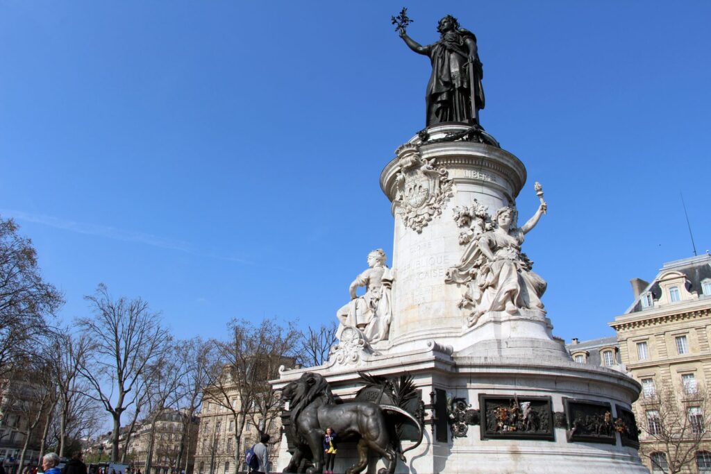 The Monument to the Republic at Place de la République in Paris under a blue sky