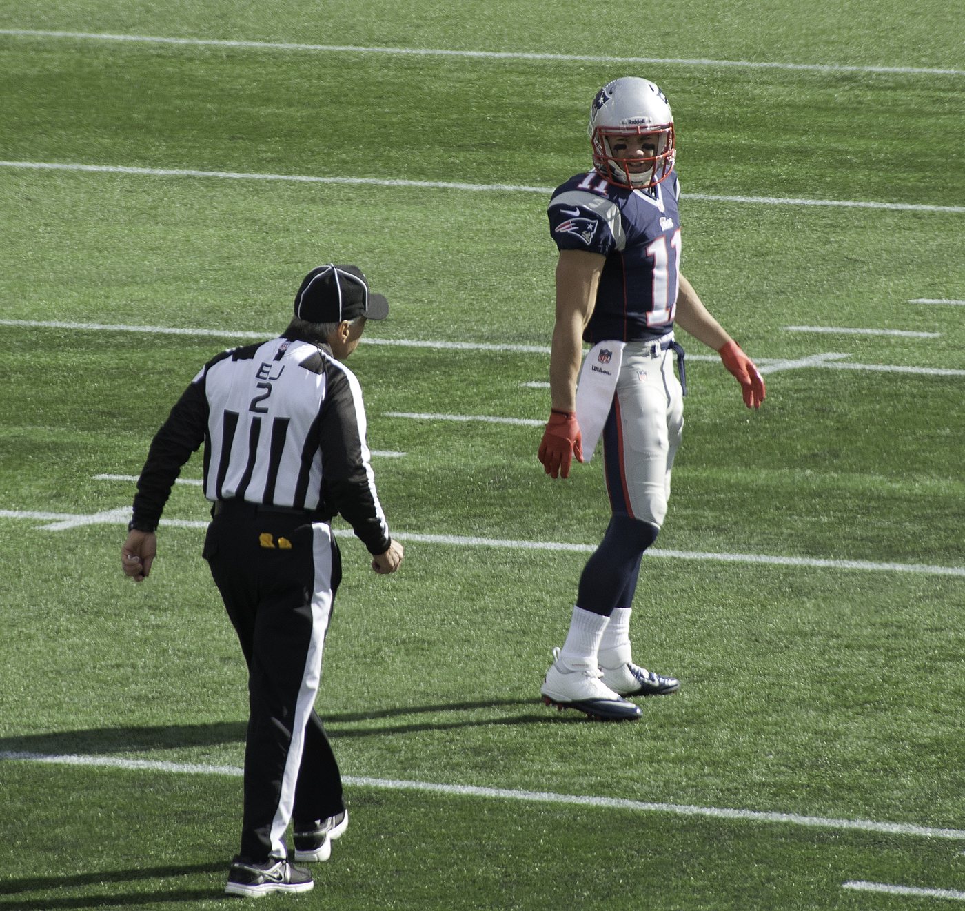 Patriots punt returner Julian Edelman talks with an official before a punt