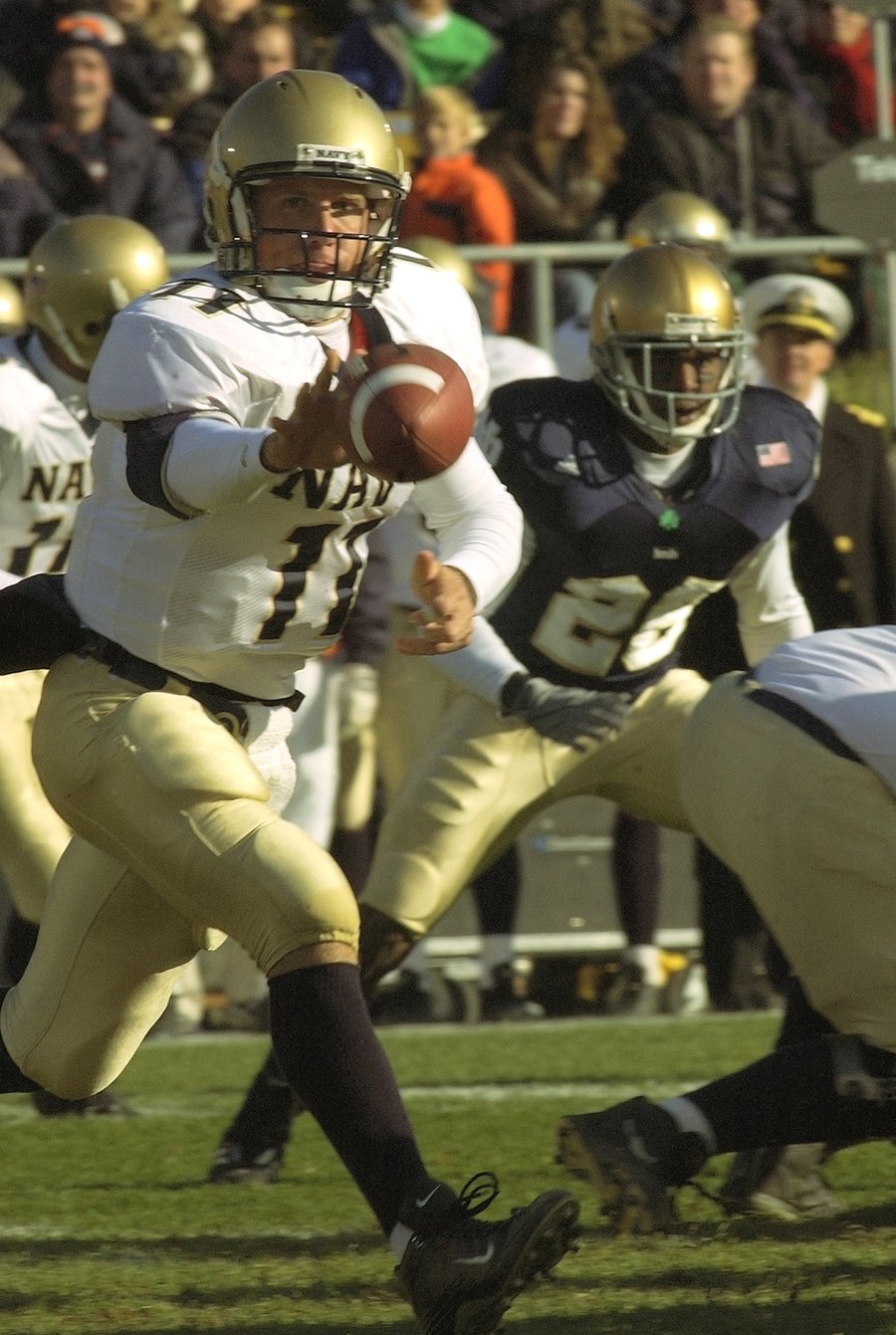 Navy quarterback Craig Candeto pitches the ball to a running back against Notre Dame