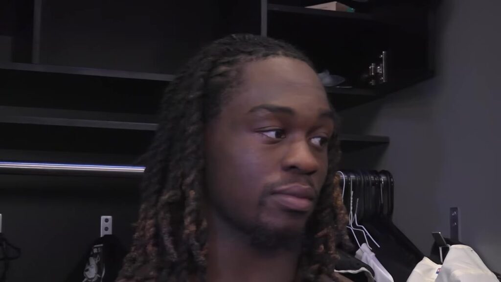 Ashton Jeanty speaks to reporters in the Raiders locker room before the Rams game