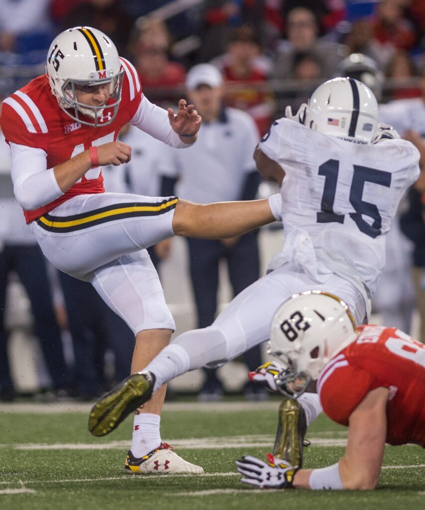 A diving defender contacts a place kicker's legs just after the kick in a college football game