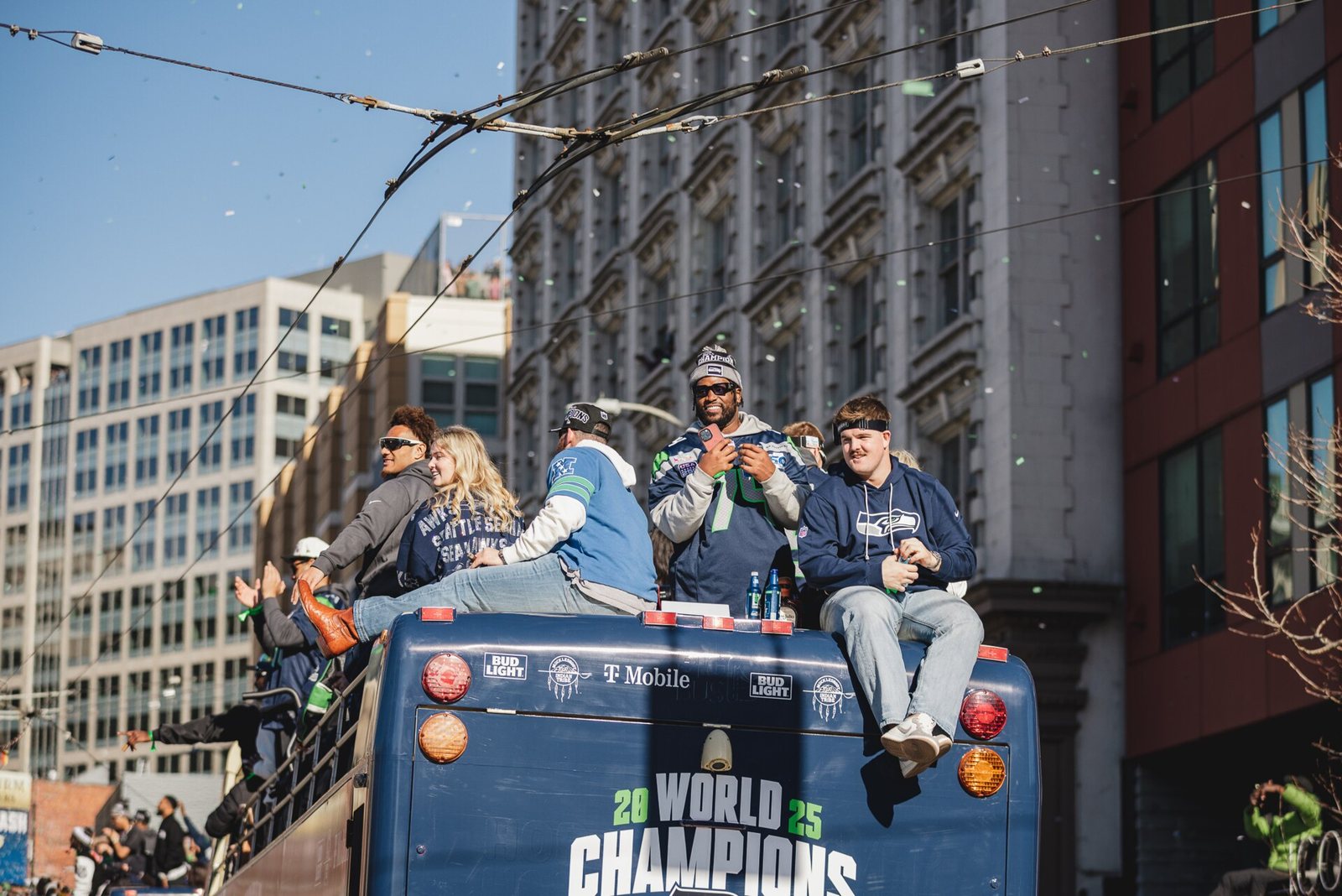 Seahawks players on a bus at the Super Bowl LX parade