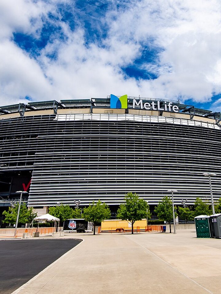 Exterior of MetLife Stadium beneath a partly cloudy sky in September 2022