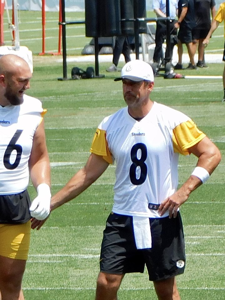 Aaron Rodgers, number 8, with Mason McCormick and Zach Frazier at Pittsburgh Steelers practice in July 2025