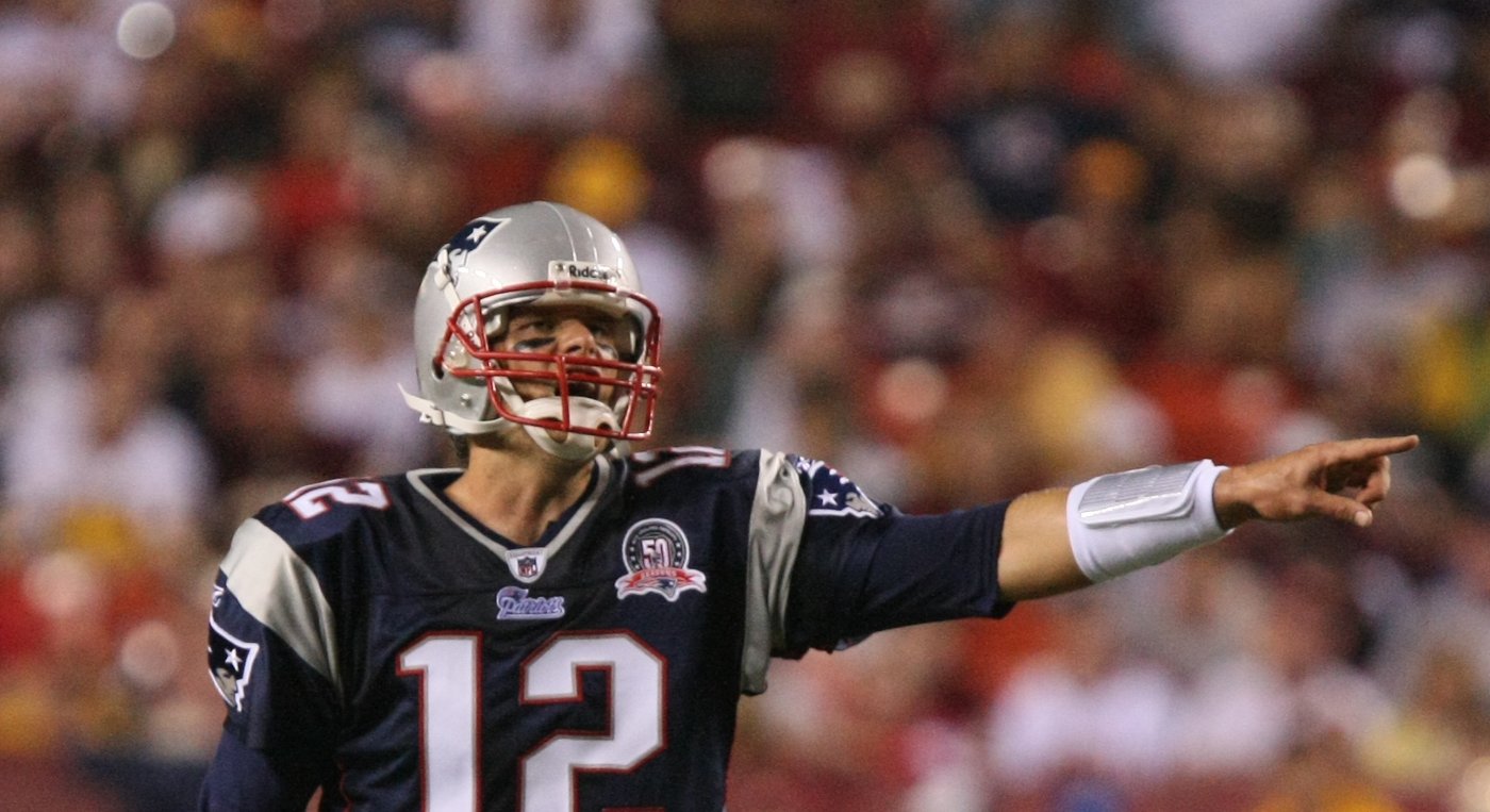Tom Brady in a New England Patriots uniform during warmups in 2009