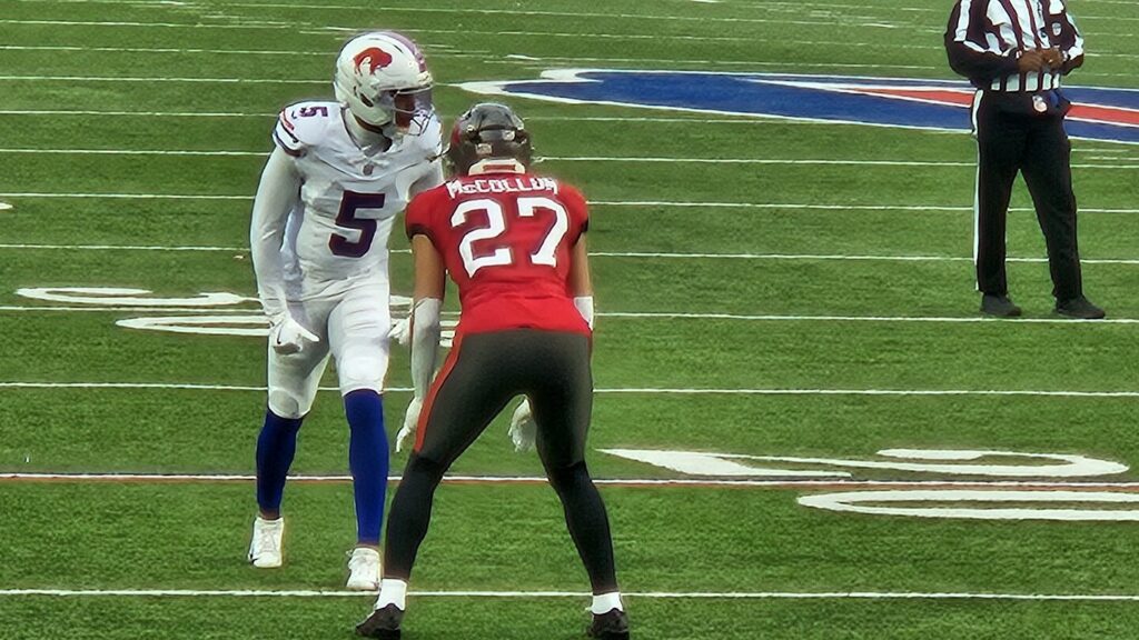 Buccaneers cornerback Zyon McCollum, wearing a red No. 27 jersey, lines up across from a Bills receiver